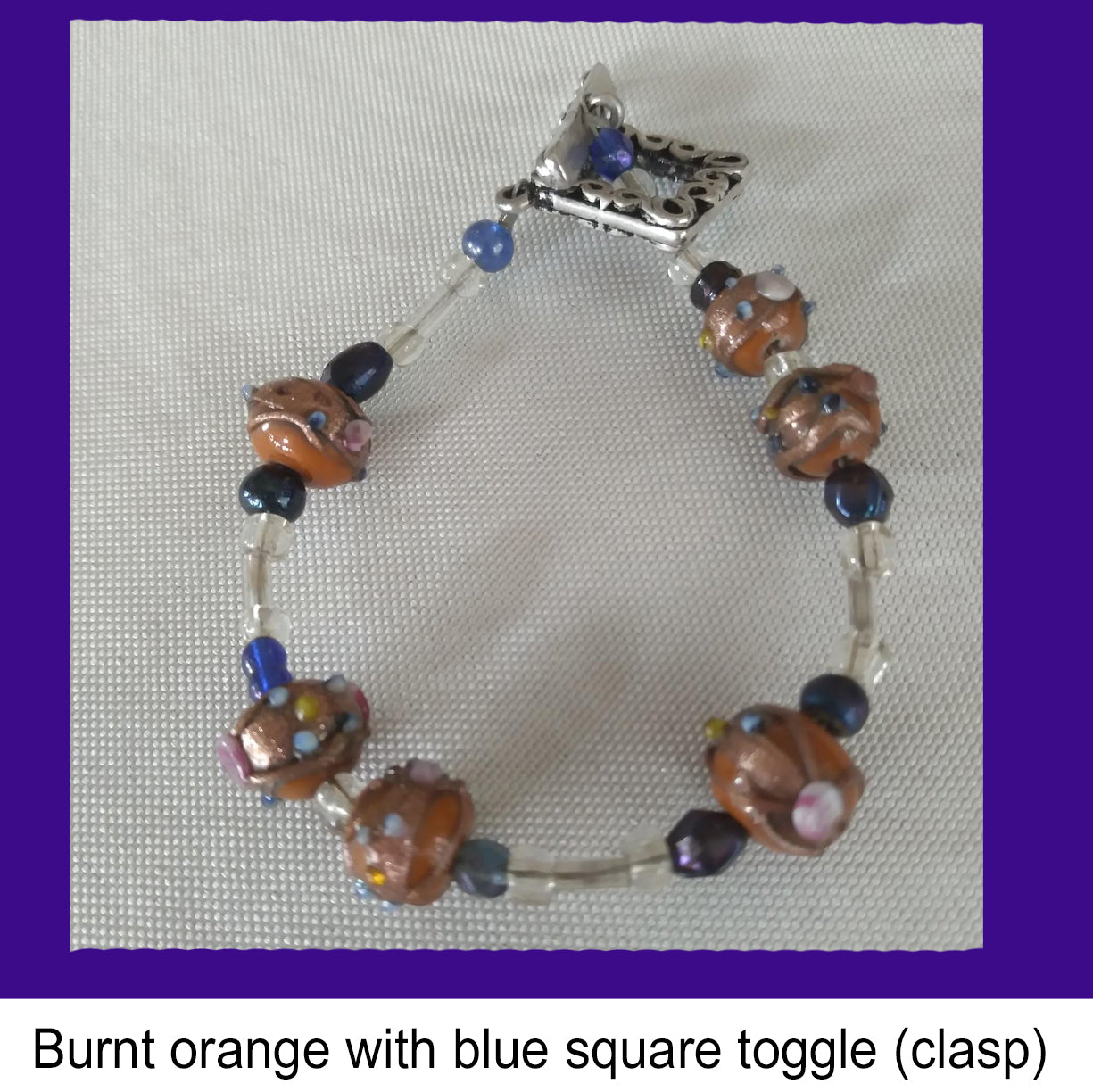 Burnt orange with blue square toggle (clasp)